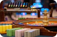 An image of a casino roule wheel and chips.