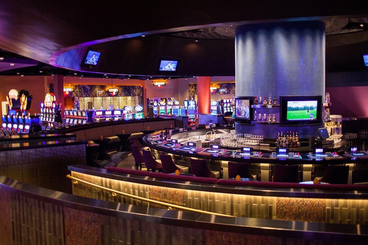 empty casino interior with row of tvs in the middle